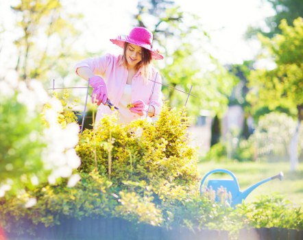 Professional gardener reviewing job details on site